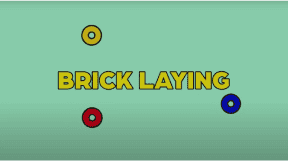 Brick laying tools and materials on a light green background.