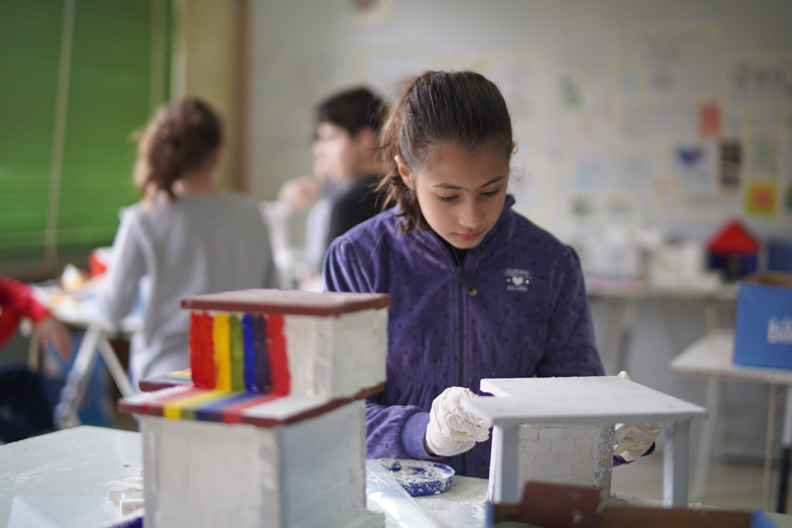 Colorful handmade craft project in children's classroom, artistic activity for kids, creative arts and crafts.